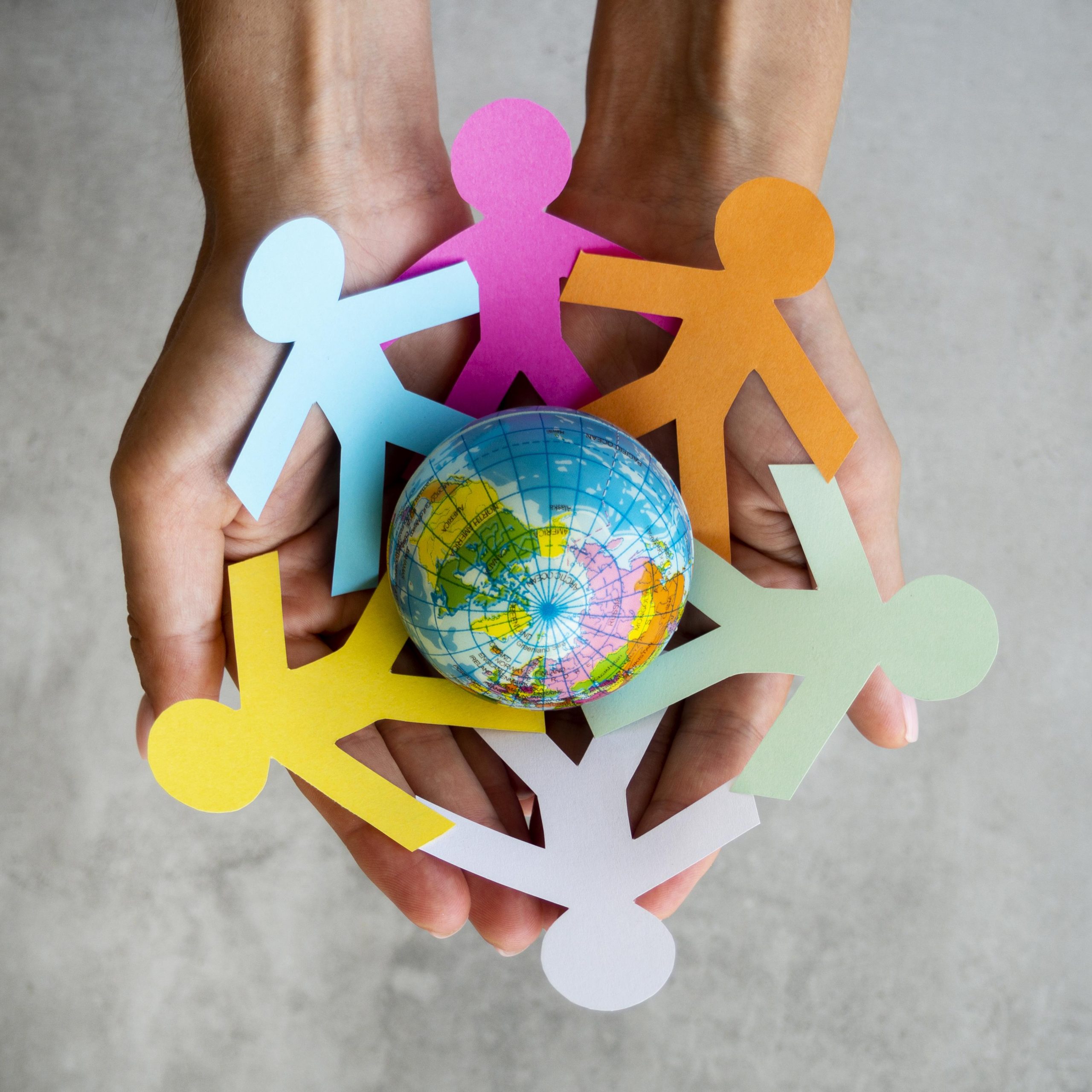 top-view-origami-chain-people-with-globe